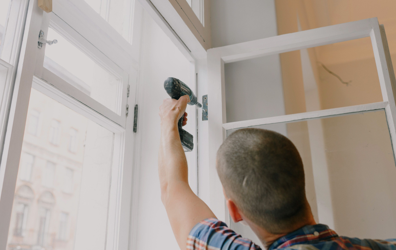 Professional home maintenance technician inspecting residential property systems