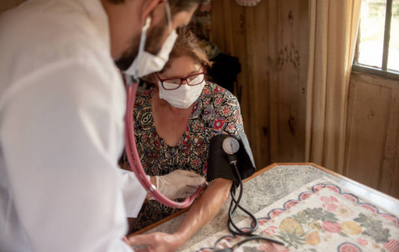 Doctor reviewing medical reports with patient