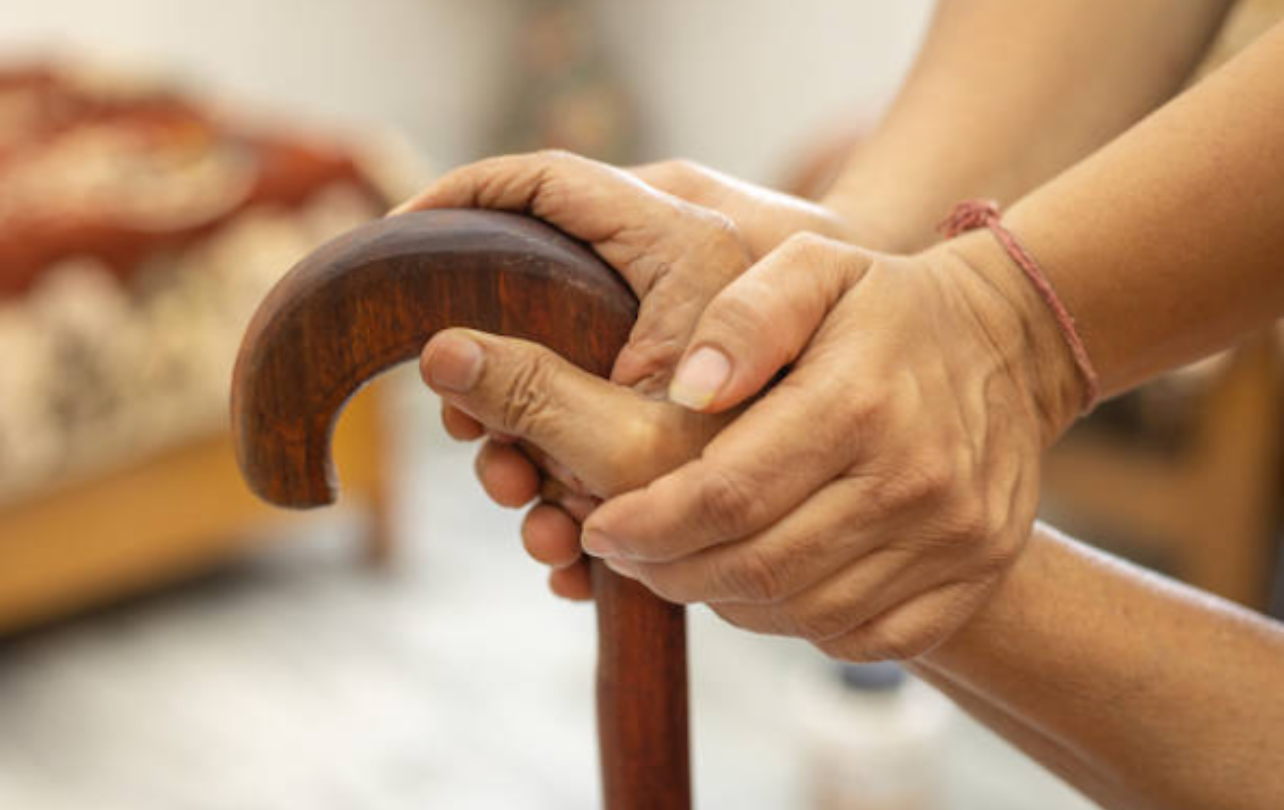 Doctor and nurse providing home healthcare assistance for senior patient