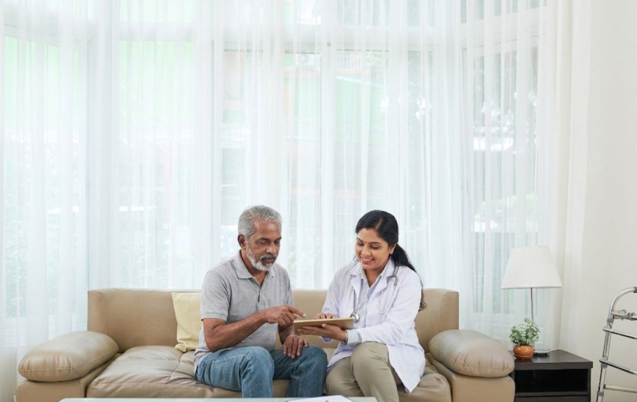 Doctor checking patient at home consultation service