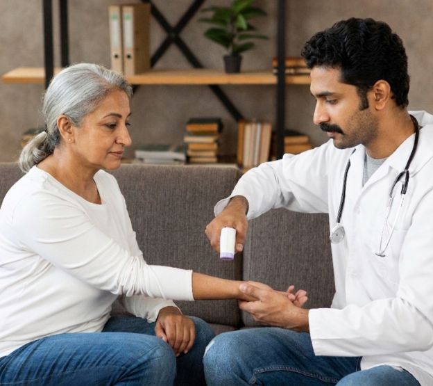 Healthcare professional providing consultation at patient home