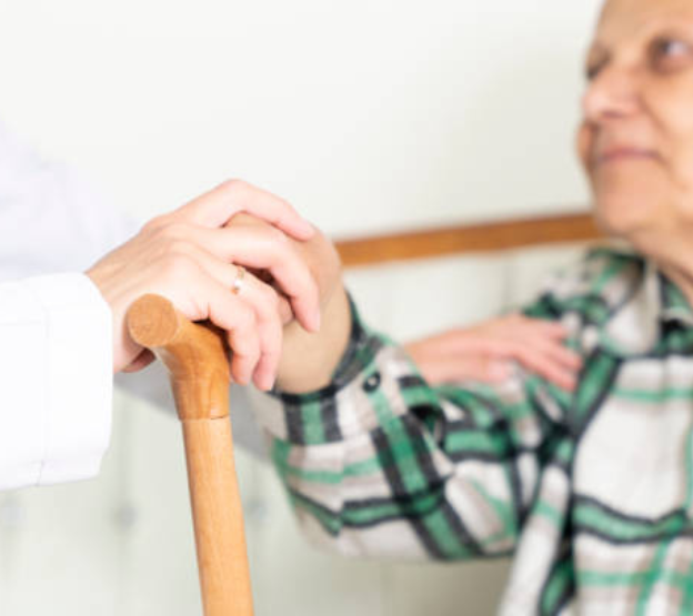 Caregiver helping elderly with daily activities