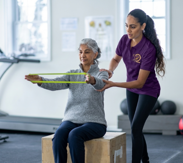 Elderly patient doing physiotherapy exercises